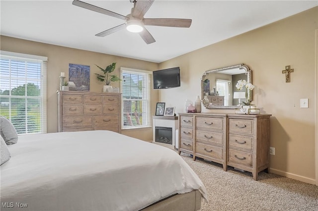 8550 Ivy Hill Dr Unit 16, Poland, OH 44514 - bedroom with light carpet, baseboards, and a ceiling fan