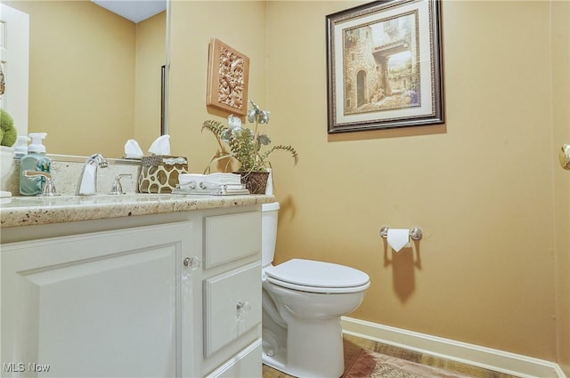 8550 Ivy Hill Dr Unit 16, Poland, OH 44514 - bathroom with vanity, toilet, baseboards, and tile patterned flooring