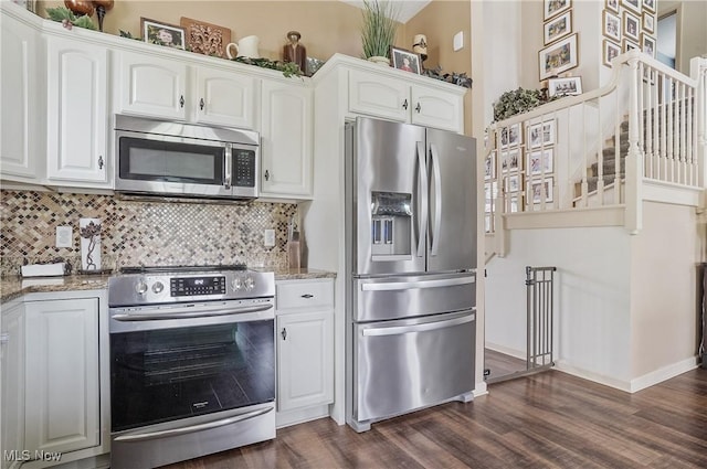8550 Ivy Hill Dr Unit 16, Poland, OH 44514 - kitchen featuring stainless steel appliances, light stone counters, and white cabinets