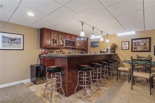 8550 Ivy Hill Dr Unit 16, Poland, OH 44514 - indoor wet bar with pendant lighting, baseboards, and a paneled ceiling