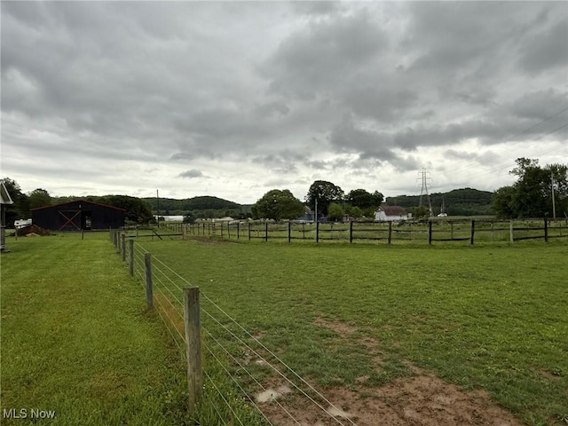 6920 Riverside Rd SE, Gnadenhutten, OH 44629 - view of yard featuring a rural view