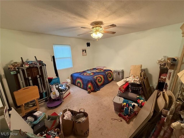 6920 Riverside Rd SE, Gnadenhutten, OH 44629 - bedroom featuring carpet flooring, ceiling fan, and a textured ceiling