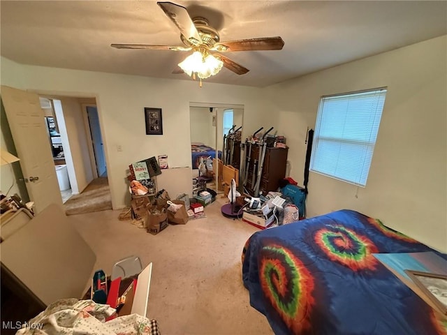 6920 Riverside Rd SE, Gnadenhutten, OH 44629 - carpeted bedroom featuring ceiling fan and multiple windows