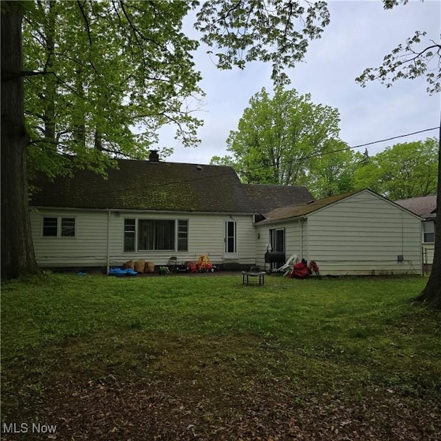 1669 Wood Rd, Cleveland Heights, OH 44121 - rear view of house with a yard