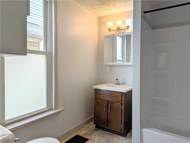 925 Camden Ave SW, Canton, OH 44706 - full bathroom featuring vanity, a textured ceiling, toilet, baseboards, and shower / bath combination