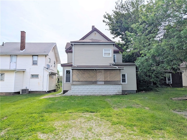 925 Camden Ave SW, Canton, OH 44706 - back of property featuring a yard, central AC unit, and a chimney