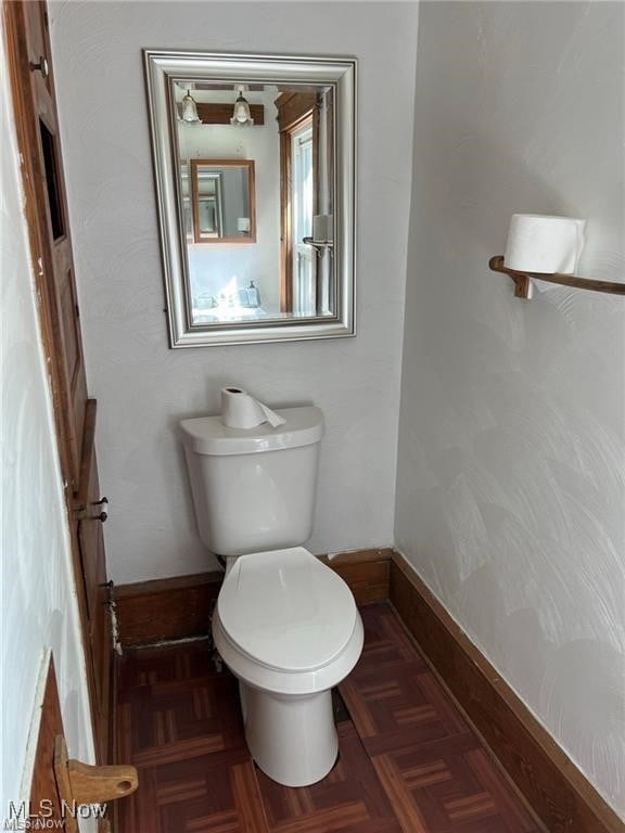 27 E Emerling Ave, Akron, OH 44301 - half bathroom featuring toilet and baseboards