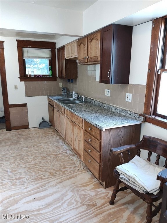 27 E Emerling Ave, Akron, OH 44301 - kitchen featuring a sink, healthy amount of natural light, and tasteful backsplash
