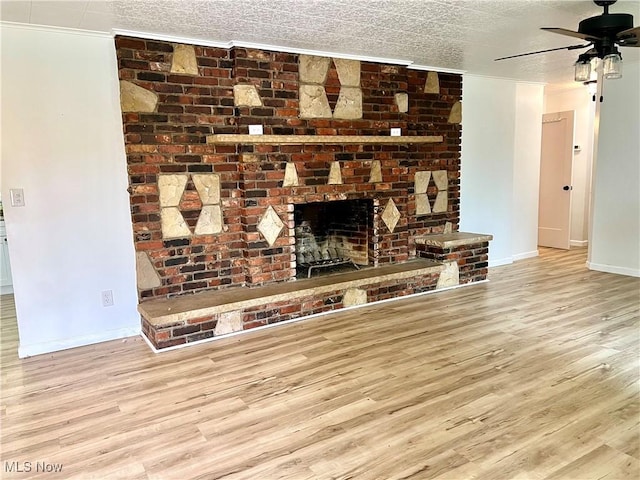 281 Hillcrest Dr, Wellsburg, WV 26070 - unfurnished living room with wood finished floors, a ceiling fan, baseboards, crown molding, and a brick fireplace