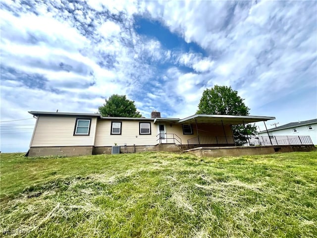 281 Hillcrest Dr, Wellsburg, WV 26070 - rear view of property with a lawn and a chimney