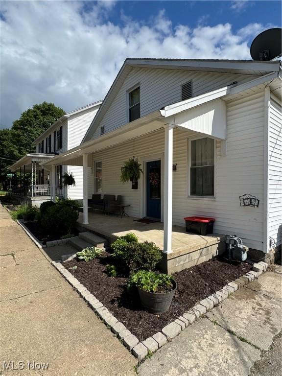 208 Walton Ave, Barnesville, OH 43713 - view of front of house with covered porch