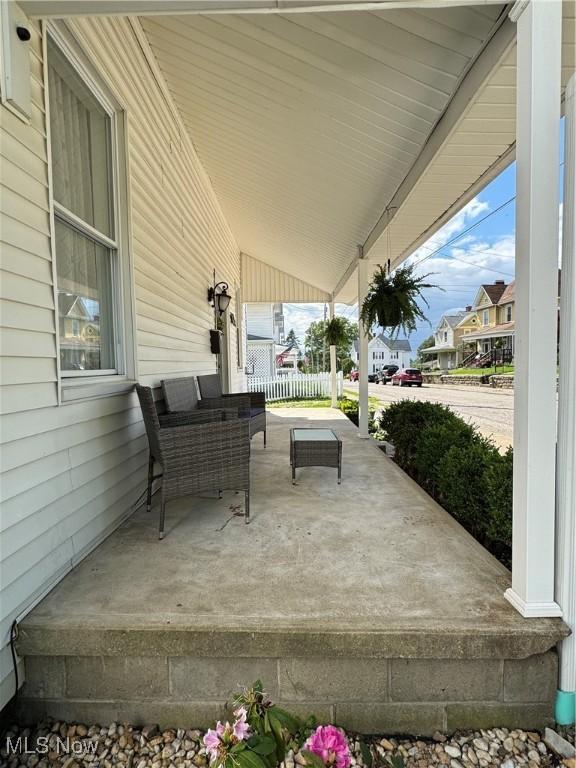 208 Walton Ave, Barnesville, OH 43713 - covered porch featuring a residential view