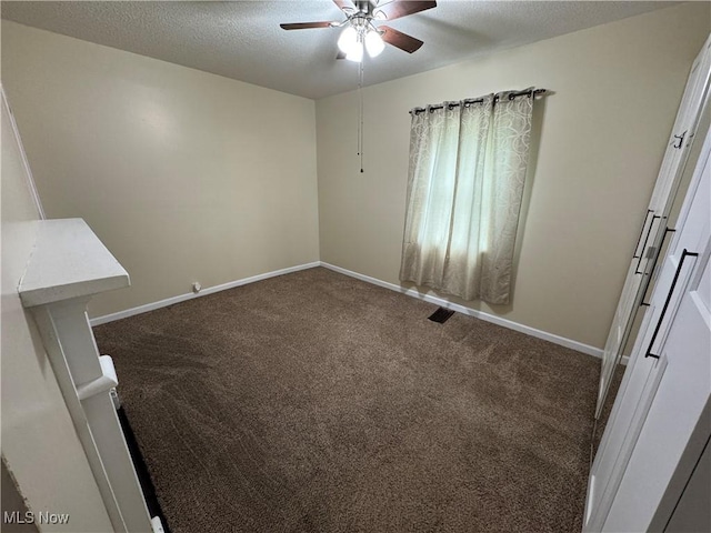 208 Walton Ave, Barnesville, OH 43713 - spare room with a ceiling fan, carpet floors, baseboards, and a textured ceiling