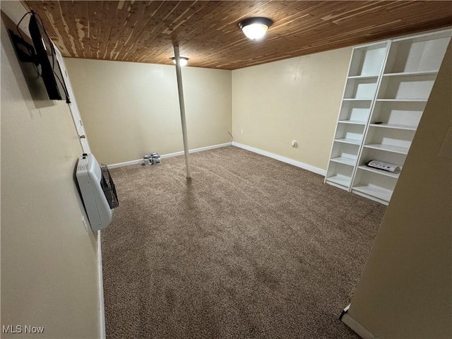 208 Walton Ave, Barnesville, OH 43713 - finished below grade area featuring carpet floors, wooden ceiling, baseboards, heating unit, and built in shelves