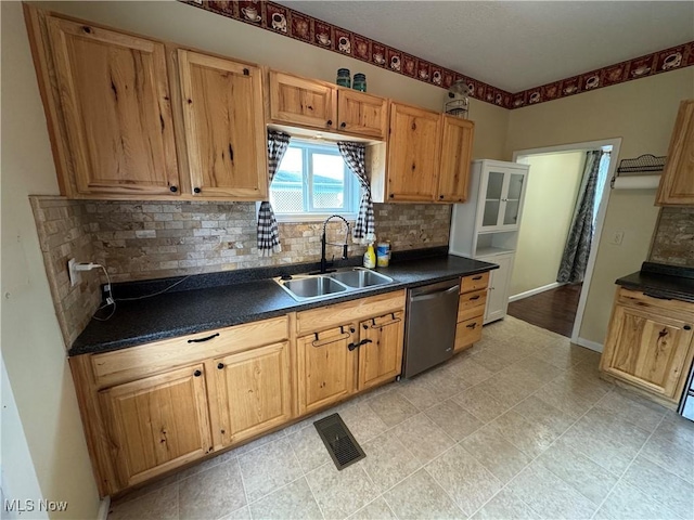 208 Walton Ave, Barnesville, OH 43713 - kitchen with a sink, dishwasher, dark countertops, tasteful backsplash, and baseboards