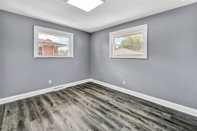 4482 W 144th St, Cleveland, OH 44135 - spare room with plenty of natural light, baseboards, and dark wood finished floors