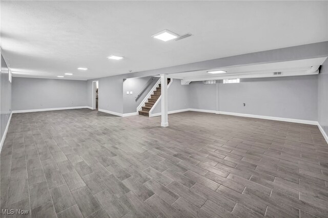 4482 W 144th St, Cleveland, OH 44135 - finished basement with stairs, baseboards, and wood finished floors