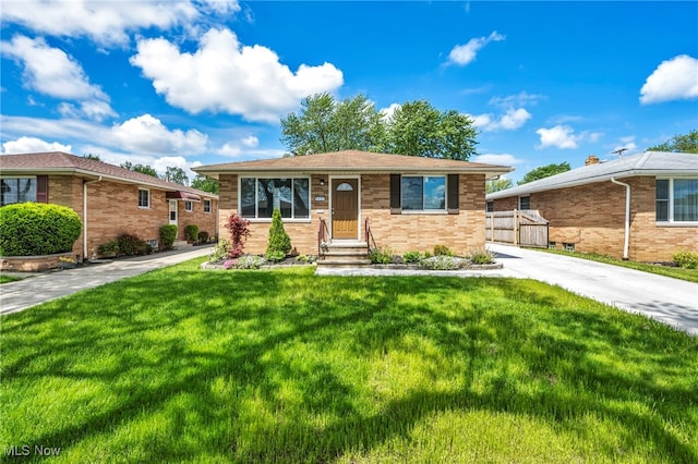 4482 W 144th St, Cleveland, OH 44135 - view of front of house featuring brick siding and a front lawn