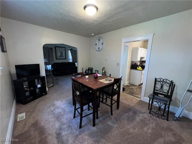 10010 Parmelee Ave, Cleveland, OH 44108 - carpeted dining area featuring a textured ceiling