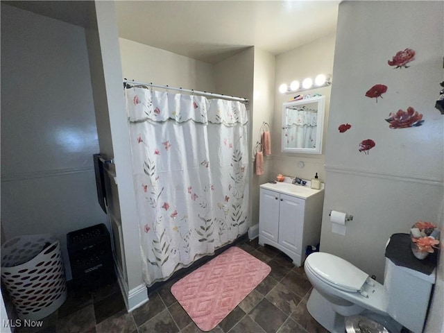 10010 Parmelee Ave, Cleveland, OH 44108 - bathroom featuring vanity, toilet, curtained shower, and stone finish flooring
