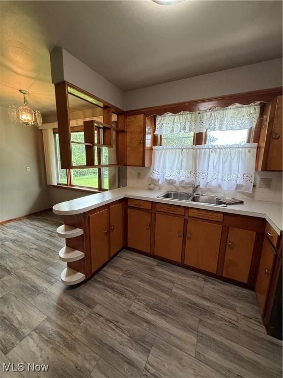 1414 W 40th St, Lorain, OH 44053 - kitchen featuring open shelves, a sink, plenty of natural light, and light countertops