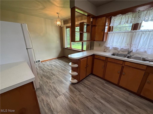 1414 W 40th St, Lorain, OH 44053 - kitchen with open shelves, freestanding refrigerator, a sink, and light countertops