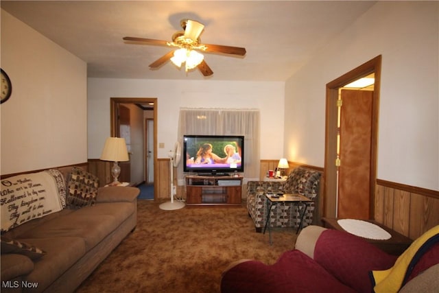 14201 Kauffman Ave, Sterling, OH 44276 - living room with a ceiling fan, carpet flooring, and a wainscoted wall