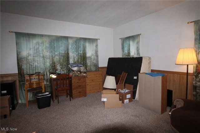14201 Kauffman Ave, Sterling, OH 44276 - living area featuring wainscoting, carpet, and wooden walls