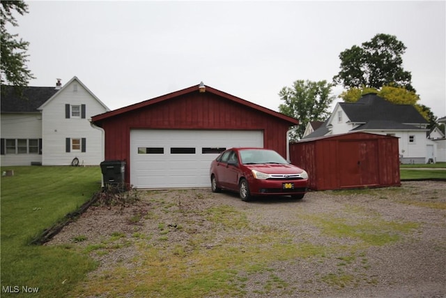 14201 Kauffman Ave, Sterling, OH 44276 - view of front facade with an outbuilding, a front lawn, and driveway