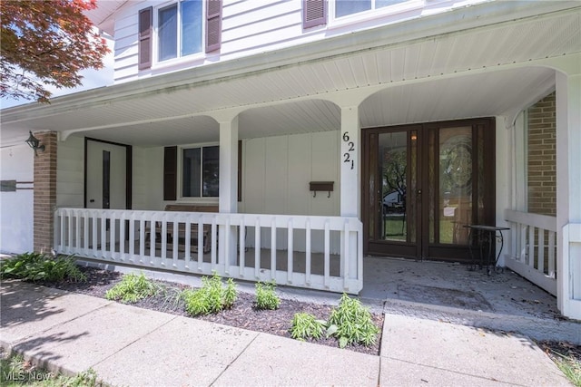 6221 Brighton Dr, North Olmsted, OH 44070 - doorway to property with covered porch and brick siding