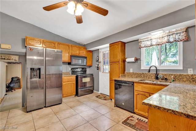 6221 Brighton Dr, North Olmsted, OH 44070 - kitchen with black appliances, a sink, light stone counters, light tile patterned flooring, and lofted ceiling