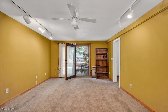 6221 Brighton Dr, North Olmsted, OH 44070 - empty room with track lighting, carpet floors, ceiling fan, and baseboards