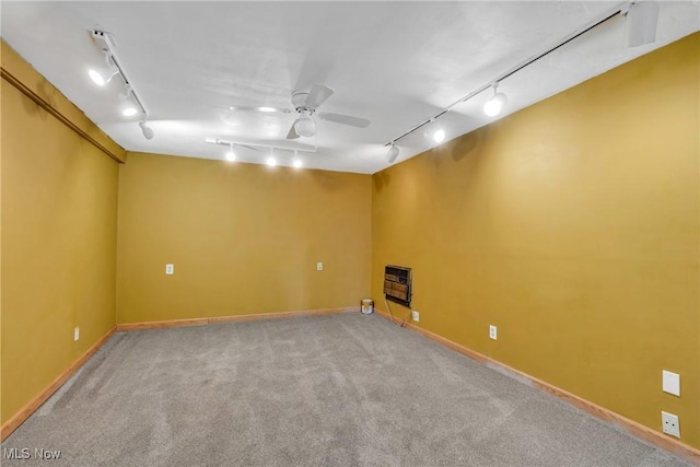 6221 Brighton Dr, North Olmsted, OH 44070 - empty room with track lighting, heating unit, light carpet, ceiling fan, and baseboards