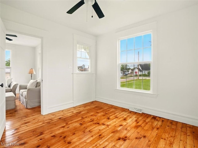 1433 W 4th St, Ashtabula, OH 44004 - spare room featuring ceiling fan, light wood finished floors, and baseboards