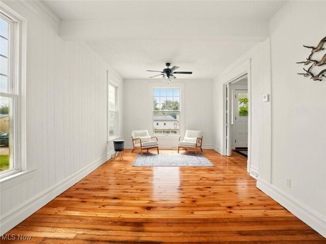 1433 W 4th St, Ashtabula, OH 44004 - sitting room with light wood-style floors, baseboards, and ceiling fan