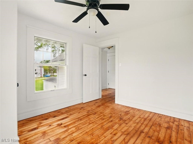 1433 W 4th St, Ashtabula, OH 44004 - empty room with hardwood / wood-style floors, baseboards, and ceiling fan