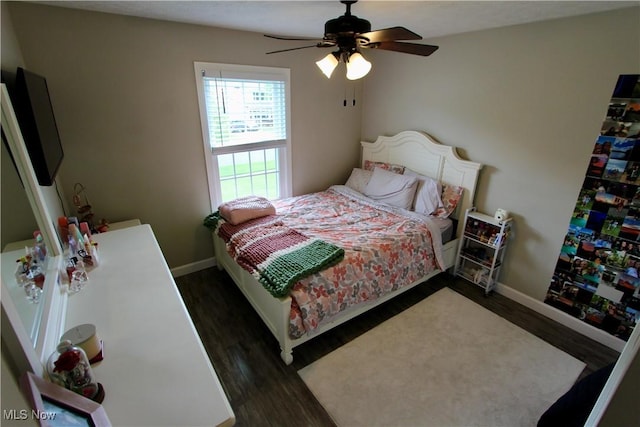 615 Wolf Ave, Wadsworth, OH 44281 - bedroom with dark wood-style floors, baseboards, and ceiling fan