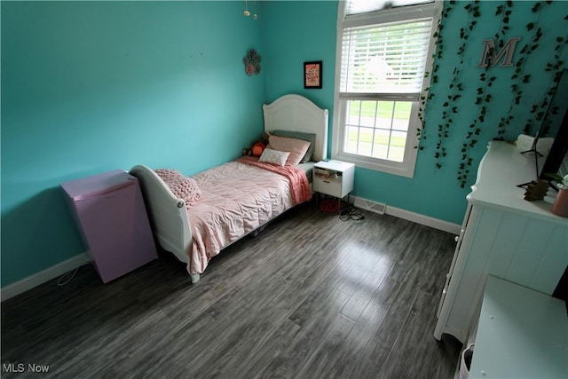615 Wolf Ave, Wadsworth, OH 44281 - bedroom with baseboards and dark wood-style floors