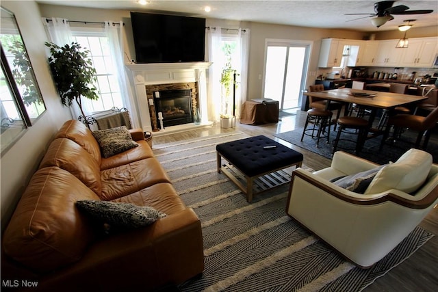 615 Wolf Ave, Wadsworth, OH 44281 - living room with healthy amount of natural light, ceiling fan, wood finished floors, and recessed lighting
