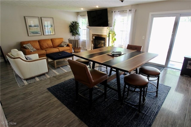615 Wolf Ave, Wadsworth, OH 44281 - dining area featuring a fireplace, wood finished floors, and recessed lighting