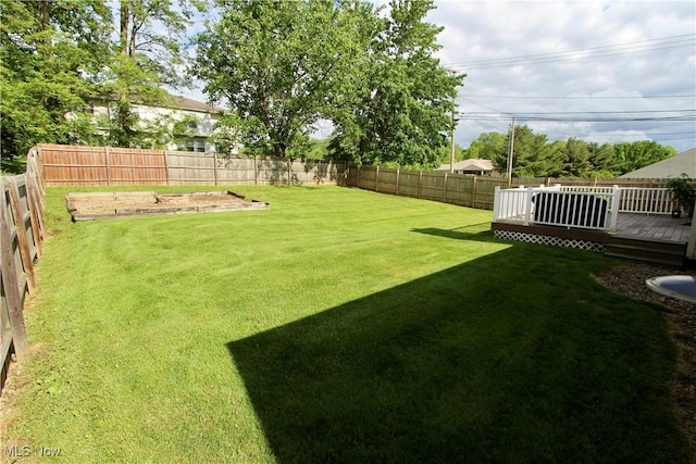 615 Wolf Ave, Wadsworth, OH 44281 - view of yard with a wooden deck and a vegetable garden