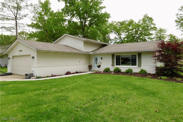 5430 Barkwood Dr, Sheffield Village, OH 44054 - view of front facade with a garage, a front yard, and driveway