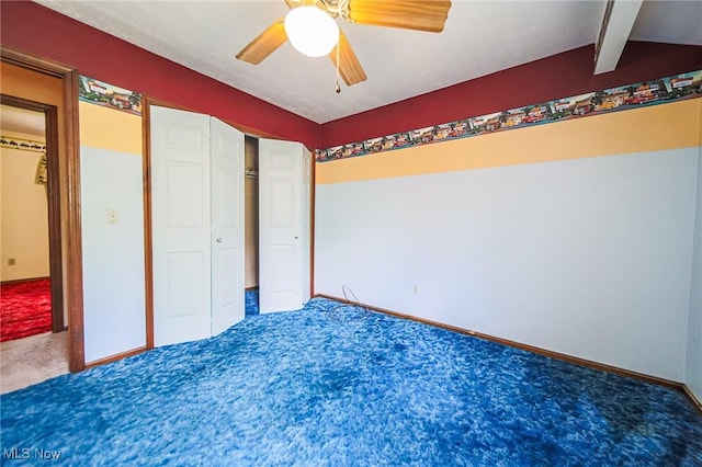 12793 New London Eastern Rd, Spencer, OH 44275 - unfurnished bedroom featuring carpet, baseboards, beam ceiling, a ceiling fan, and a closet