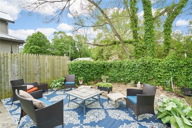 1050 W Main Ct, Geneva, OH 44041 - view of patio / terrace with an outdoor living space