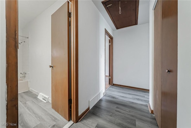 27701 Mills Ave Unit 2N, Euclid, OH 44132 - hallway featuring attic access, wood finished floors, and baseboards