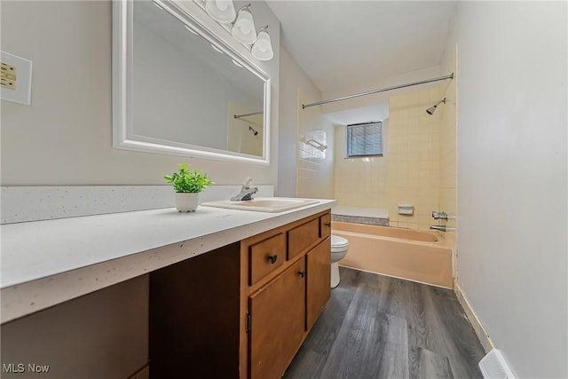 27701 Mills Ave Unit 2N, Euclid, OH 44132 - bathroom featuring toilet, vanity,  shower combination, and wood finished floors