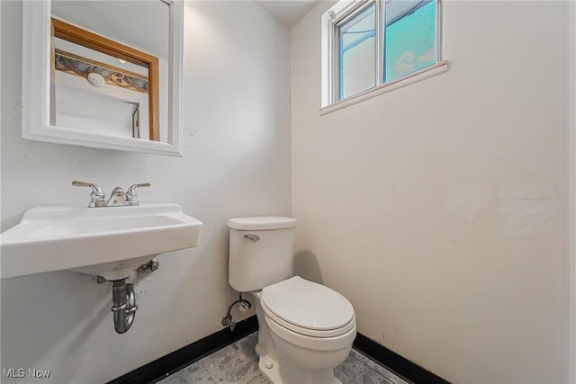 27701 Mills Ave Unit 2N, Euclid, OH 44132 - bathroom with baseboards and toilet