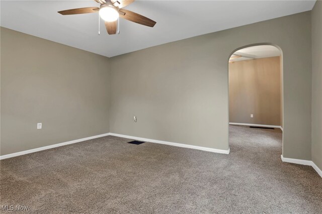 1664 Linden Ave, South Zanesville, OH 43701 - spare room featuring arched walkways, carpet flooring, ceiling fan, and baseboards