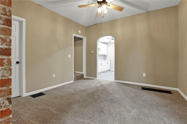 1664 Linden Ave, South Zanesville, OH 43701 - unfurnished room with a ceiling fan, arched walkways, carpet flooring, and baseboards