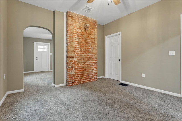 1664 Linden Ave, South Zanesville, OH 43701 - empty room featuring arched walkways, carpet, a ceiling fan, and baseboards